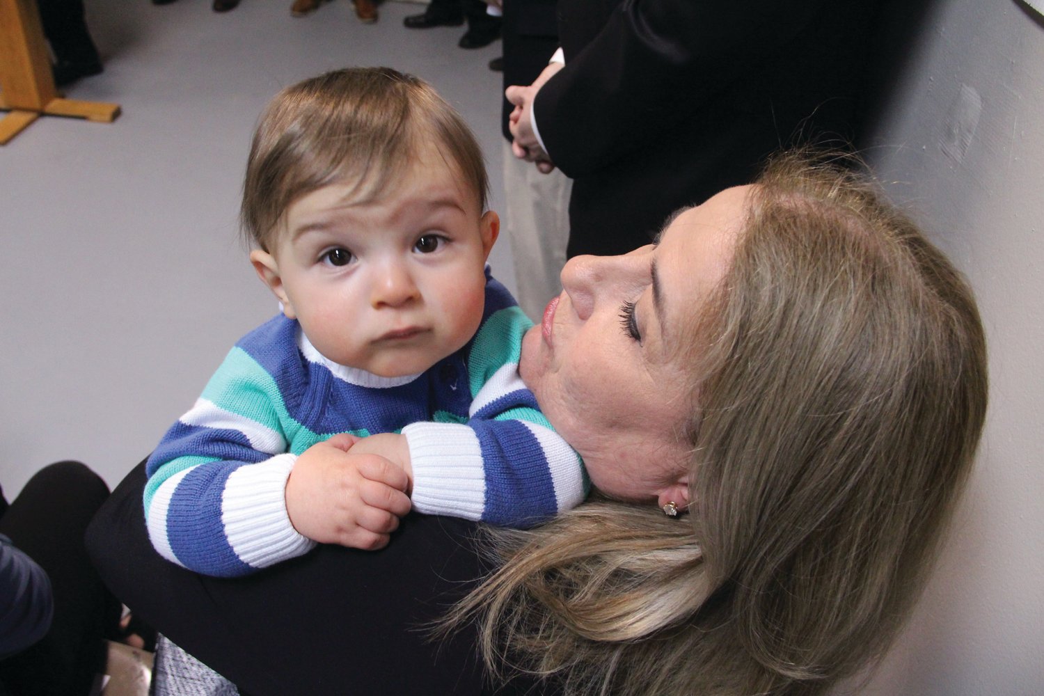 LITTLEST JOE: Grandmother Lucy Polisena holds Joseph Polisena III at his father's mayoral campaign announcement on Monday.